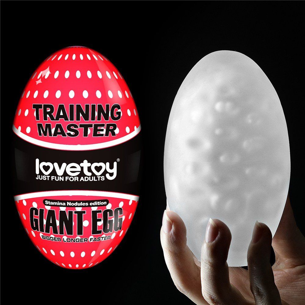 Masturbador masculino Giant Egg Stamina Nodules en mano, mostrando la textura con nódulos internos en color blanco translúcido.